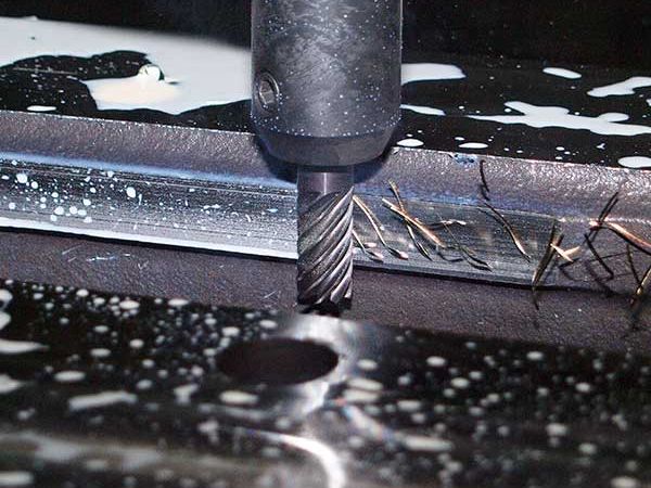 CNC machine cutting metal for sign fabrication
