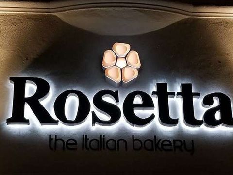 Halo-lit Rosetta bakery letters