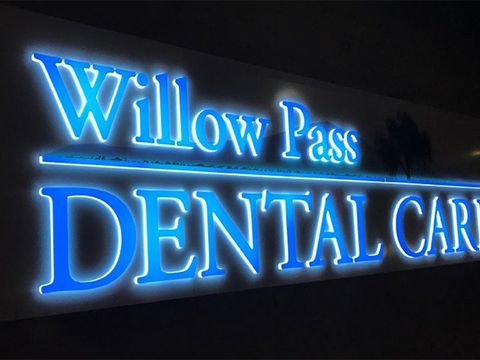 Blue-lit Willow Pass Dental Care letters